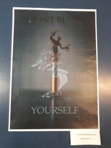 plakat, z papierosa wychodzi dym przypominjący człowieka